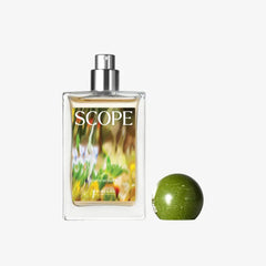 Perfume bottle labeled 'SCOPE' with a green apple on a white background