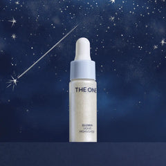 Skincare bottle labeled 'The One' against a starry night sky background