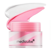 Pink cream jar with open lid on a white background, featuring the Medicube brand.