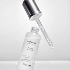 Novage+ AHA peel solution bottle with dropper on a light gray background