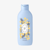 Blue bottle of shower gel with decorative label on a white background