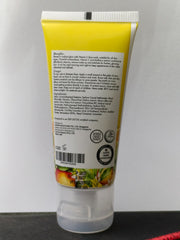 Tube of sunscreen with a yellow label on a gray background