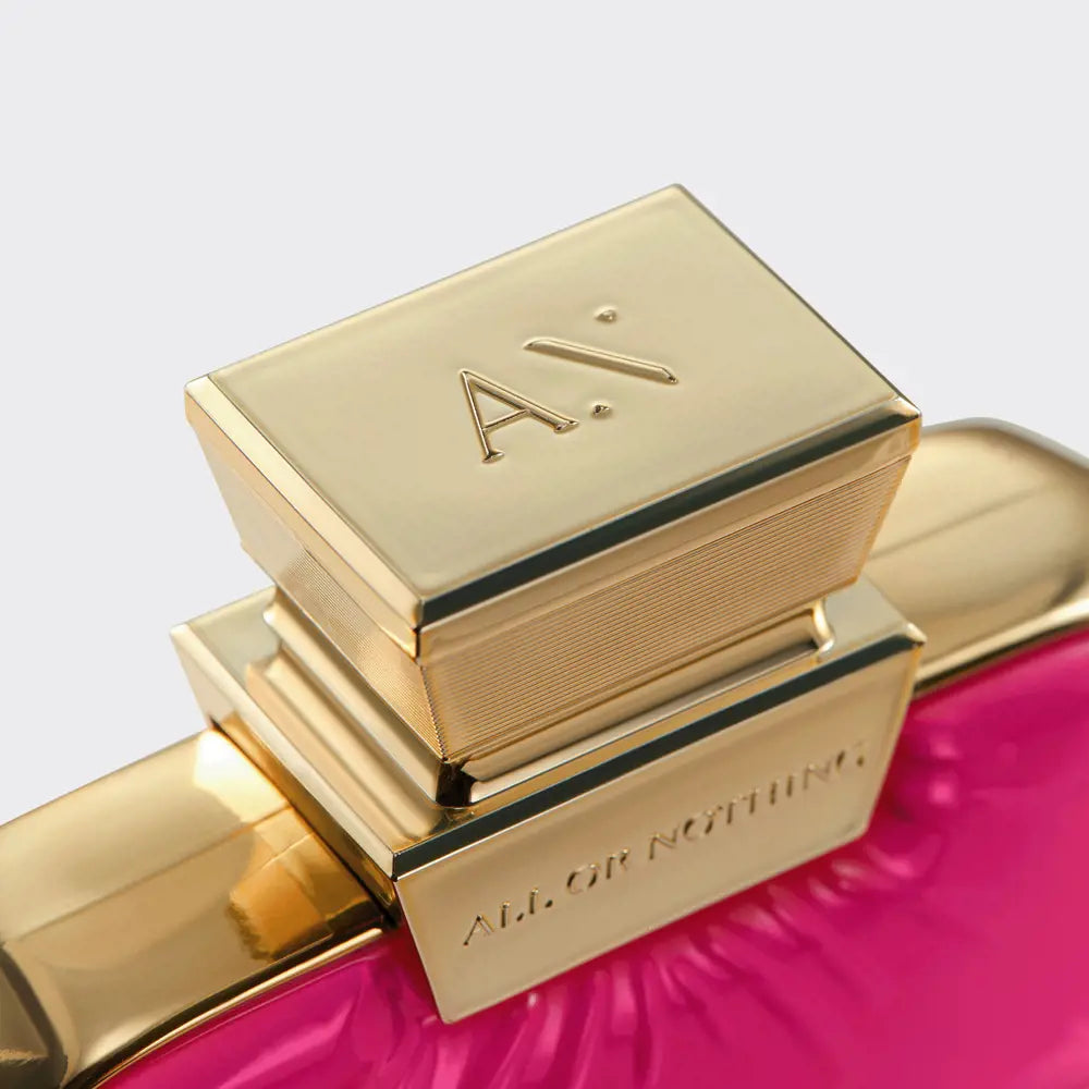 Gold and pink cosmetic product with 'Alessandro' branding on a light gray background