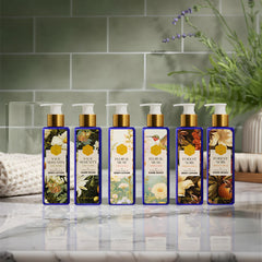 Set of body care products with floral designs on a bathroom counter.