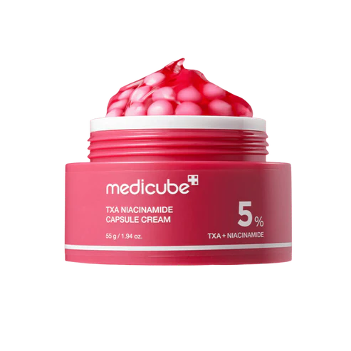 Pink jar of Medicube TXA Niacinamide Capsule Cream with a white cap on a white background