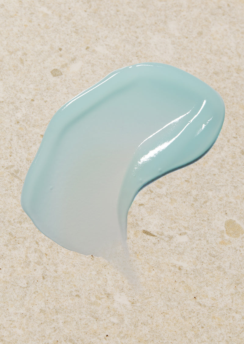 Blue paint smear on beige sand