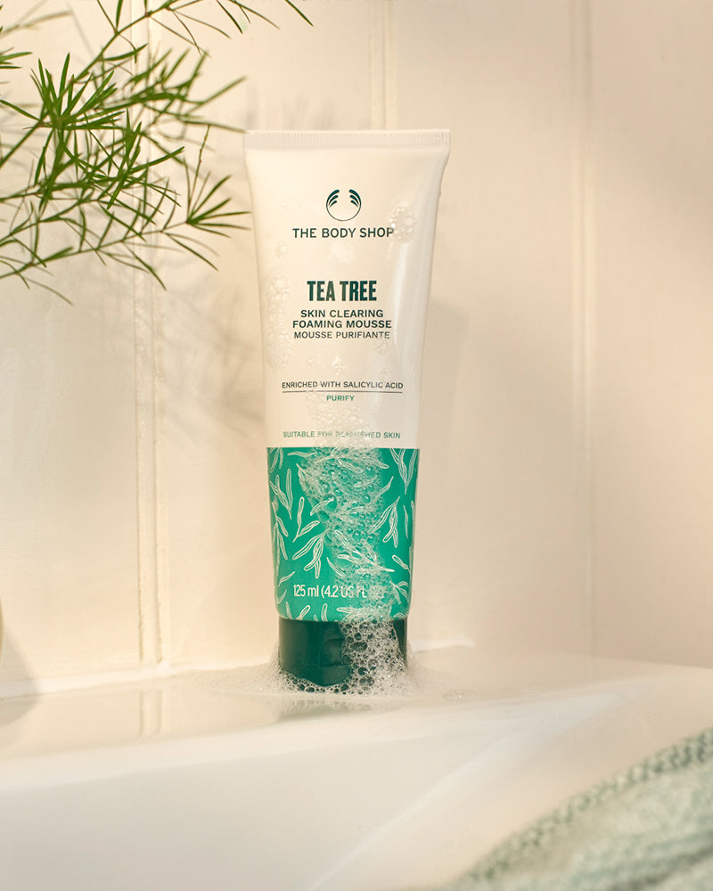 Tube of The Body Shop Tea Tree Skin Clearing Foaming Gel on a neutral background