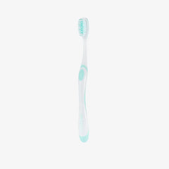 White toothbrush with green accents on a white background