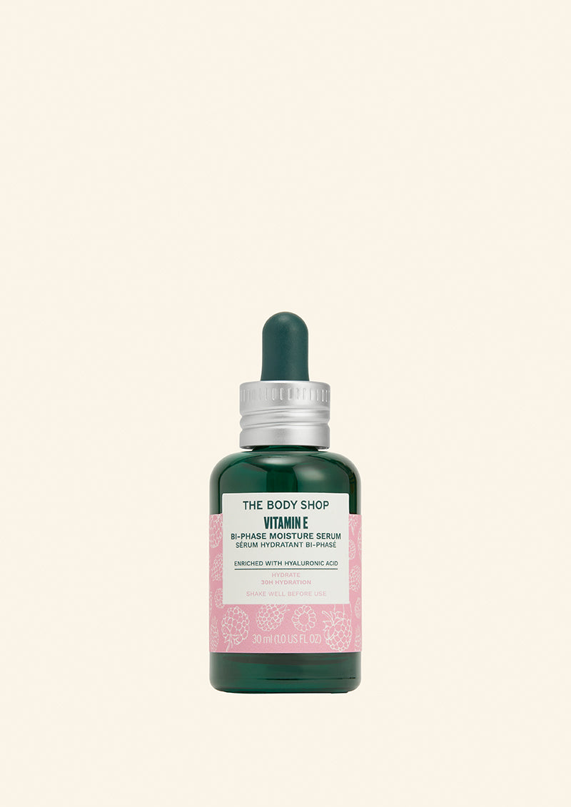 The Body Shop Vitamin E serum bottle on a light green background