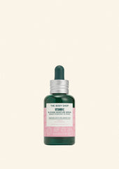 The Body Shop Vitamin E serum bottle on a light green background