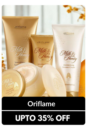 Oriflame Milk & Honey Gold body care products: creamy shower lotion, sugar scrub, and body cream.